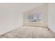 Bright bedroom with carpet floors and a large window letting in natural light at 4327 E 98Th Pl, Thornton, CO 80229