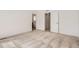 Bedroom with modern carpeting and interior door to bathroom at 4327 E 98Th Pl, Thornton, CO 80229