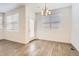 Dining room featuring modern flooring and light fixture, neutral paint, and glass door to the outdoors at 4327 E 98Th Pl, Thornton, CO 80229