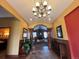 Elegantly decorated hallway with warm lighting and tasteful decor leading to a relaxing lounge area at 4327 E 98Th Pl, Thornton, CO 80229