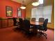 Professional meeting room with a large table, comfortable seating, and natural light at 4327 E 98Th Pl, Thornton, CO 80229