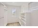Walk-in closet featuring a window, shelving and closet rods at 4327 E 98Th Pl, Thornton, CO 80229