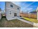 Fenced backyard with green grass and concrete patio at 2409 W 38Th Ave, Denver, CO 80211