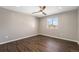 Bedroom with hardwood floors, ceiling fan, and a bright window at 2409 W 38Th Ave, Denver, CO 80211