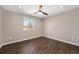 Bedroom featuring hardwood floors, ceiling fan, and natural light at 2409 W 38Th Ave, Denver, CO 80211