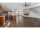 Open living room featuring hardwood floors, fireplace, modern kitchen and stainless appliances at 2409 W 38Th Ave, Denver, CO 80211