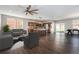 Spacious living room with hardwood floors, kitchen with island, and dining area at 2409 W 38Th Ave, Denver, CO 80211