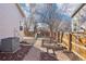 Spacious backyard featuring mature trees, a play structure, and ample space for outdoor activities at 4844 Mt Evans St, Brighton, CO 80601