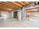 Spacious unfinished basement featuring modern mechanicals and ample room for storage or future expansion at 4844 Mt Evans St, Brighton, CO 80601