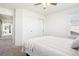 Bedroom with carpet, ceiling fan, closet, and view into hall at 4844 Mt Evans St, Brighton, CO 80601