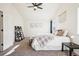 Bright bedroom with neutral tones, carpet floors, and ample natural light from large windows at 4844 Mt Evans St, Brighton, CO 80601