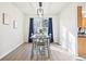 Bright dining room with modern table, chairs, large window, and stylish accents, perfect for gatherings at 4844 Mt Evans St, Brighton, CO 80601