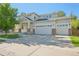 Charming two-story home with a three-car garage, covered porch, and well-maintained landscaping at 4844 Mt Evans St, Brighton, CO 80601