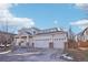 Two-story home with three-car garage, covered porch, and well-maintained landscaping in a Gathering-friendly neighborhood at 4844 Mt Evans St, Brighton, CO 80601