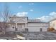 Charming two-story home with a three car garage, front porch and brick accents, located in a desirable neighborhood at 4844 Mt Evans St, Brighton, CO 80601