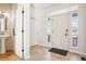 Bright foyer featuring tile flooring, a pedestal sink, a closet, and plenty of natural light at 4844 Mt Evans St, Brighton, CO 80601