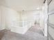 Hallway with carpet and pendant light at 4844 Mt Evans St, Brighton, CO 80601