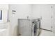 A bright laundry room with a full-size washer and dryer at 4844 Mt Evans St, Brighton, CO 80601