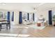 Bright living room featuring large windows and a ceiling fan at 4844 Mt Evans St, Brighton, CO 80601