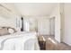 Sunlit main bedroom featuring access to the ensuite bathroom and walk-in closet at 4844 Mt Evans St, Brighton, CO 80601