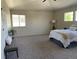 Beautiful main bedroom showcases carpet floors, large windows, a ceiling fan and ample natural light at 4844 Mt Evans St, Brighton, CO 80601