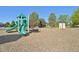 Community playground featuring climbing structures, swings, and slides at 4844 Mt Evans St, Brighton, CO 80601