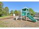 Community playground with slides, swings, and climbing wall at 4844 Mt Evans St, Brighton, CO 80601