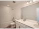 Clean bathroom with tiled tub, sleek vanity, and bright lighting for a refreshing space at 13729 Daffodil Pt, Parker, CO 80134