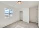 Bright bedroom featuring carpet floors, built in closet, and lots of light from the window at 13729 Daffodil Pt, Parker, CO 80134