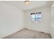 Cozy bedroom with plush carpeting, natural light, and scenic outdoor views at 13729 Daffodil Pt, Parker, CO 80134