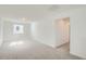 Large bonus room with neutral walls, carpet, and natural light, ideal for flexible living at 13729 Daffodil Pt, Parker, CO 80134
