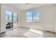 Bonus room featuring durable light colored flooring, sliding glass doors, and a large window at 13729 Daffodil Pt, Parker, CO 80134