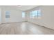 Bonus room featuring durable light colored flooring and multiple large windows at 13729 Daffodil Pt, Parker, CO 80134