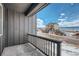 Balcony view of ongoing construction with machinery and newly built homes under a cloudy sky at 13729 Daffodil Pt, Parker, CO 80134