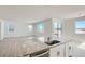 Spacious open concept kitchen featuring stainless steel appliances, granite countertops, and an island with a sink at 13729 Daffodil Pt, Parker, CO 80134
