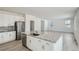 Spacious open concept kitchen featuring stainless steel appliances and granite countertops at 13729 Daffodil Pt, Parker, CO 80134