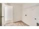 Functional laundry room with durable flooring, utility connections, and storage options at 13729 Daffodil Pt, Parker, CO 80134