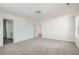 Expansive main bedroom with open doorway, carpeted floors, and view to a bathroom at 13729 Daffodil Pt, Parker, CO 80134