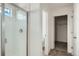 Modern bathroom with tiled shower, glass door, and adjacent access to the closet at 13729 Daffodil Pt, Parker, CO 80134