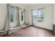 Bedroom featuring three large windows providing natural light, undergoing renovation at 1900 S University Blvd, Denver, CO 80210
