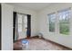 Bedroom featuring two large windows providing natural light, undergoing renovation at 1900 S University Blvd, Denver, CO 80210