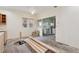 Living room with fireplace, undergoing renovation with natural light at 1900 S University Blvd, Denver, CO 80210
