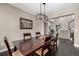 Formal dining room featuring hardwood floors, decorative lighting and stairs to the upper level at 16658 E 106Th Dr, Commerce City, CO 80022