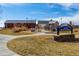 A view of the Reunion Recreation Center complex with well-maintained landscaping and clear signage for community visibility at 16658 E 106Th Dr, Commerce City, CO 80022