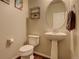 Cozy half bathroom featuring a pedestal sink and neutral decor at 26881 E Roxbury Pl, Aurora, CO 80016