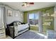 Bright bedroom with a window, -themed décor, and a cozy daybed at 26881 E Roxbury Pl, Aurora, CO 80016