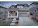 Charming two-story home with a two-car garage and covered front porch at 26881 E Roxbury Pl, Aurora, CO 80016