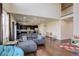 Bright open concept living area flows into kitchen with a large sectional couch and high ceilings at 26881 E Roxbury Pl, Aurora, CO 80016