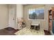 Bright, airy playroom area, showcasing a large window and decorative rug at 26881 E Roxbury Pl, Aurora, CO 80016