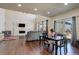 Inviting living room with hardwood floors, fireplace, and ample natural light at 26881 E Roxbury Pl, Aurora, CO 80016